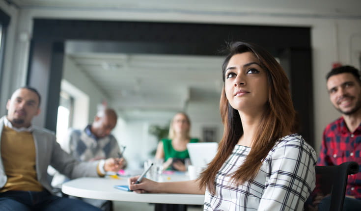 woman taking notes
